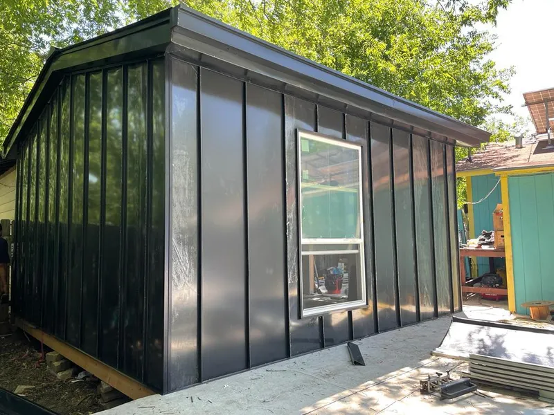 Black standing seam metal wall panels for Roof Inspection in Davison