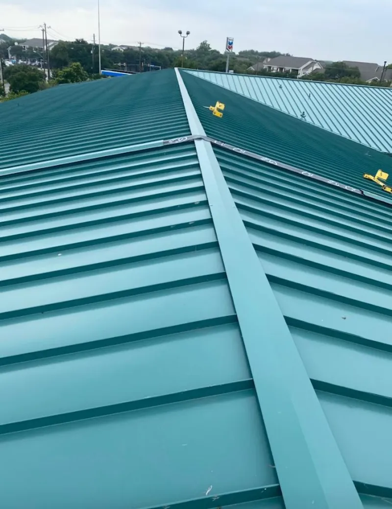 Green commercial metal roof ridge and valley for Metal Roof Repair in Davison