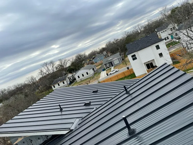 Standing seam metal roof panels with vents for Skylight Repair in Davison